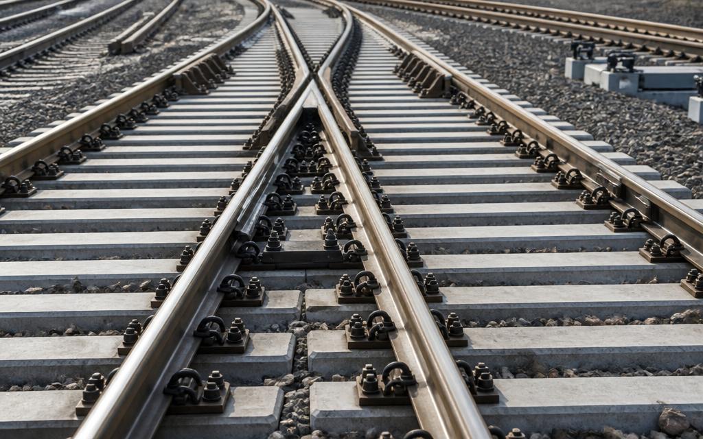 Railway turnout with rails, concrete sleepers and fastening systems